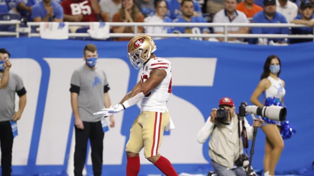 Sep 12, 2021; Detroit, Michigan, USA; San Francisco 49ers running back Elijah Mitchell (25) celebrates after scoring a touchdown during the second quarter against the Detroit Lions at Ford Field. Mandatory Credit: Raj Mehta-USA TODAY Sports